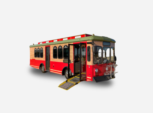 Red and tan trolley bus with extended ramp for wheelchair access