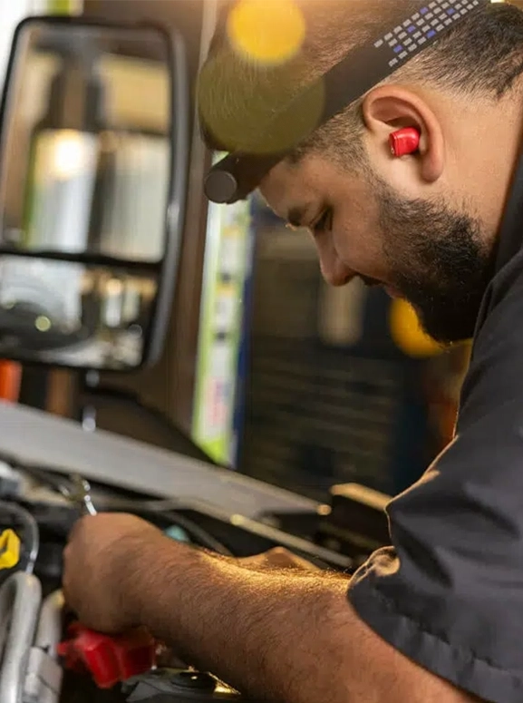 a mechanic working on an engine